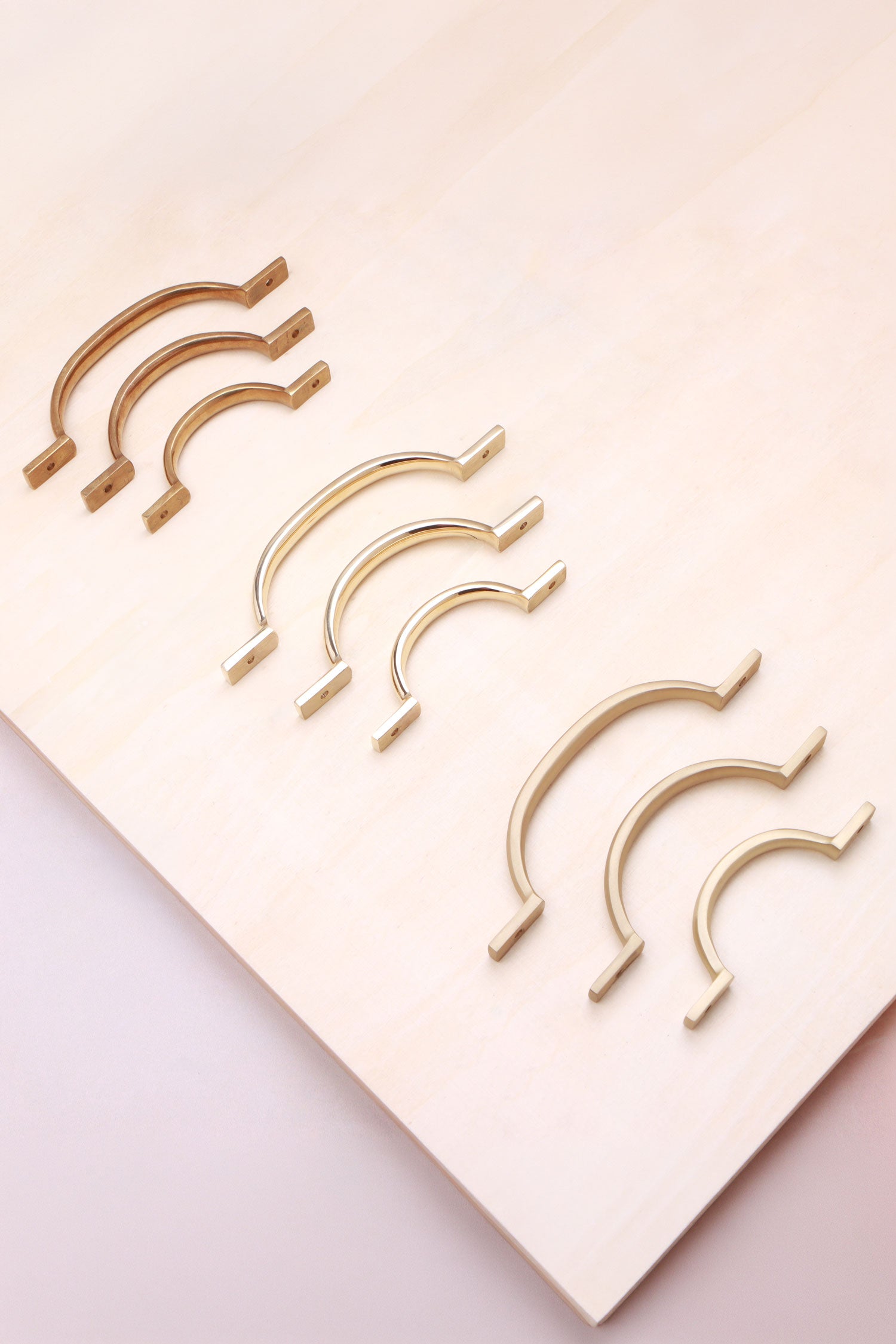 Solid brass cabinet D handles shown together in all three lengths
