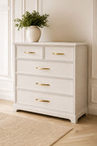 Brass cabinet D handles fitted to a painted chest of drawers