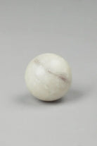 White marble cabinet knob close-up showing natural veining — G Decor