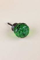 Emerald Green faceted glass ball cabinet knob, a rich deep green, on an antique brass finish base with its fixing bolt