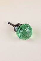 Light Green faceted glass ball cabinet knob, a bright fresh green, on an antique brass finish base with its fixing bolt