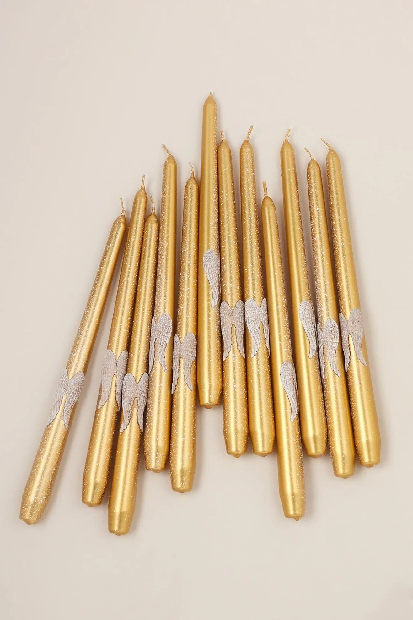Featheré Wings Pair of Gold Wax Taper Candles with Angel Wing Detail — lifestyle view, G Decor
