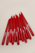 Featheré Wings Pair of Red Wax Taper Candles with Angel Wing Detail — lifestyle view, G Decor