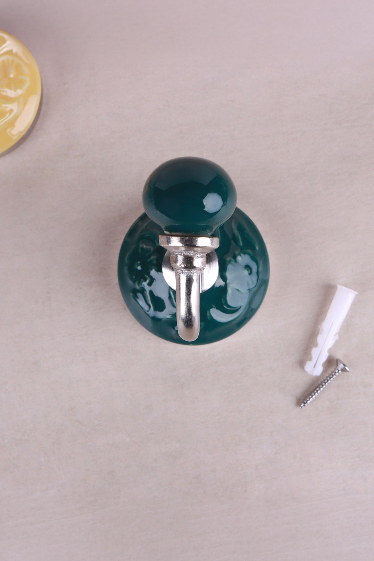 Dark green floral ceramic wall hook with a chrome hook