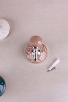 Dusky pink floral ceramic wall hook with a chrome hook