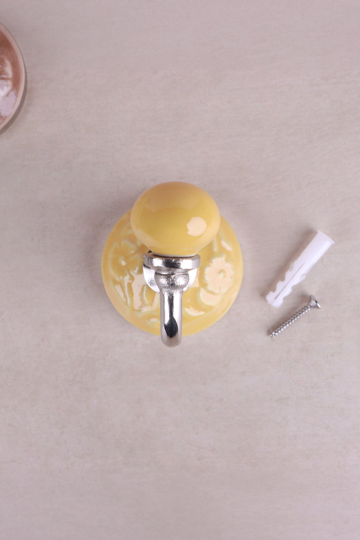 Yellow floral ceramic wall hook with a chrome hook