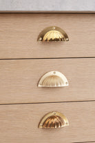 Fluted cup pull in polished, aged and satin brass, second view