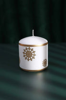 Golden Snowflake Pillar Candle with Gold Foil Trim and White Wax — close-up view, G Decor