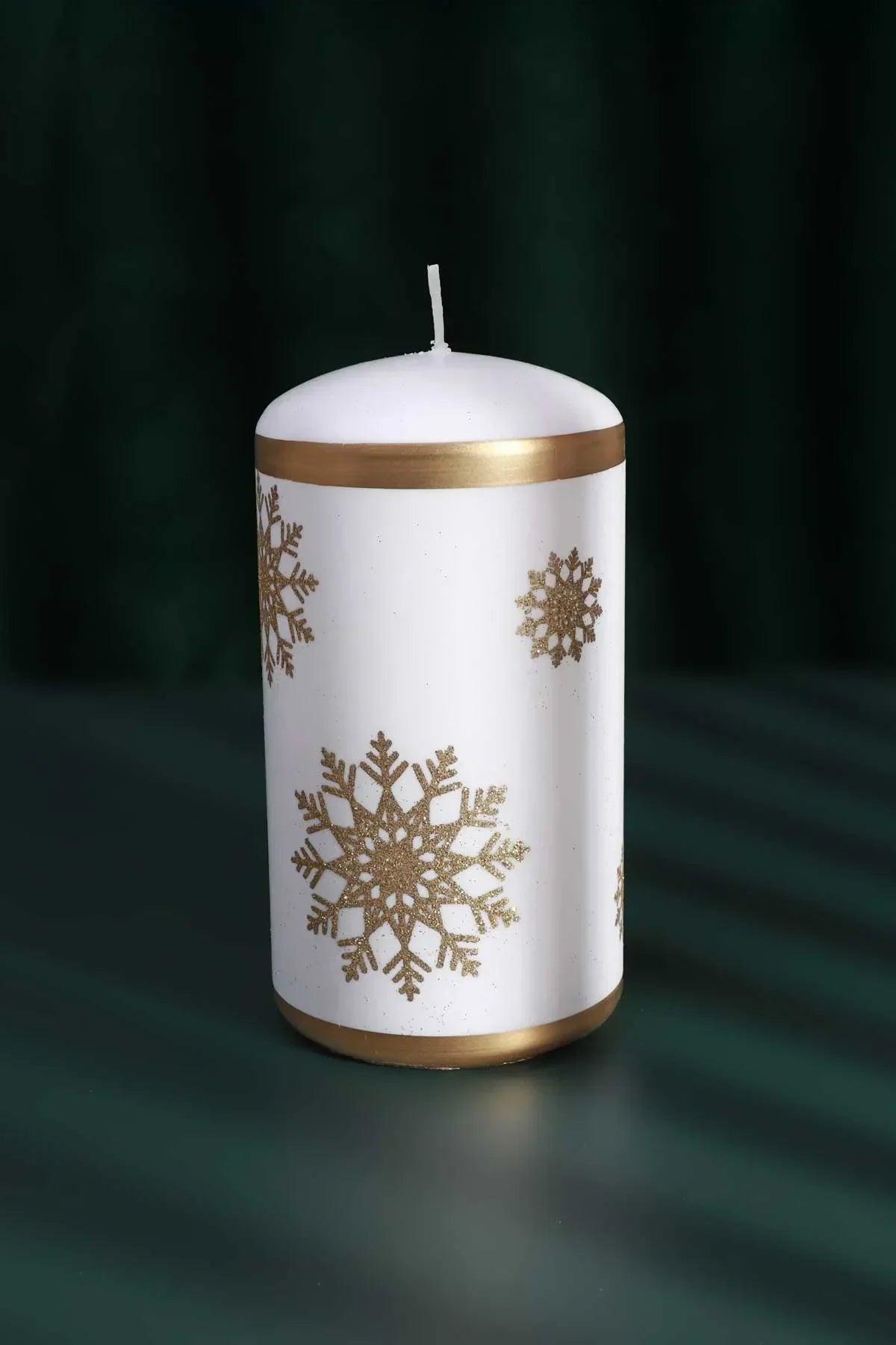 Golden Snowflake Pillar Candle with Gold Foil Trim and White Wax — lifestyle view, G Decor