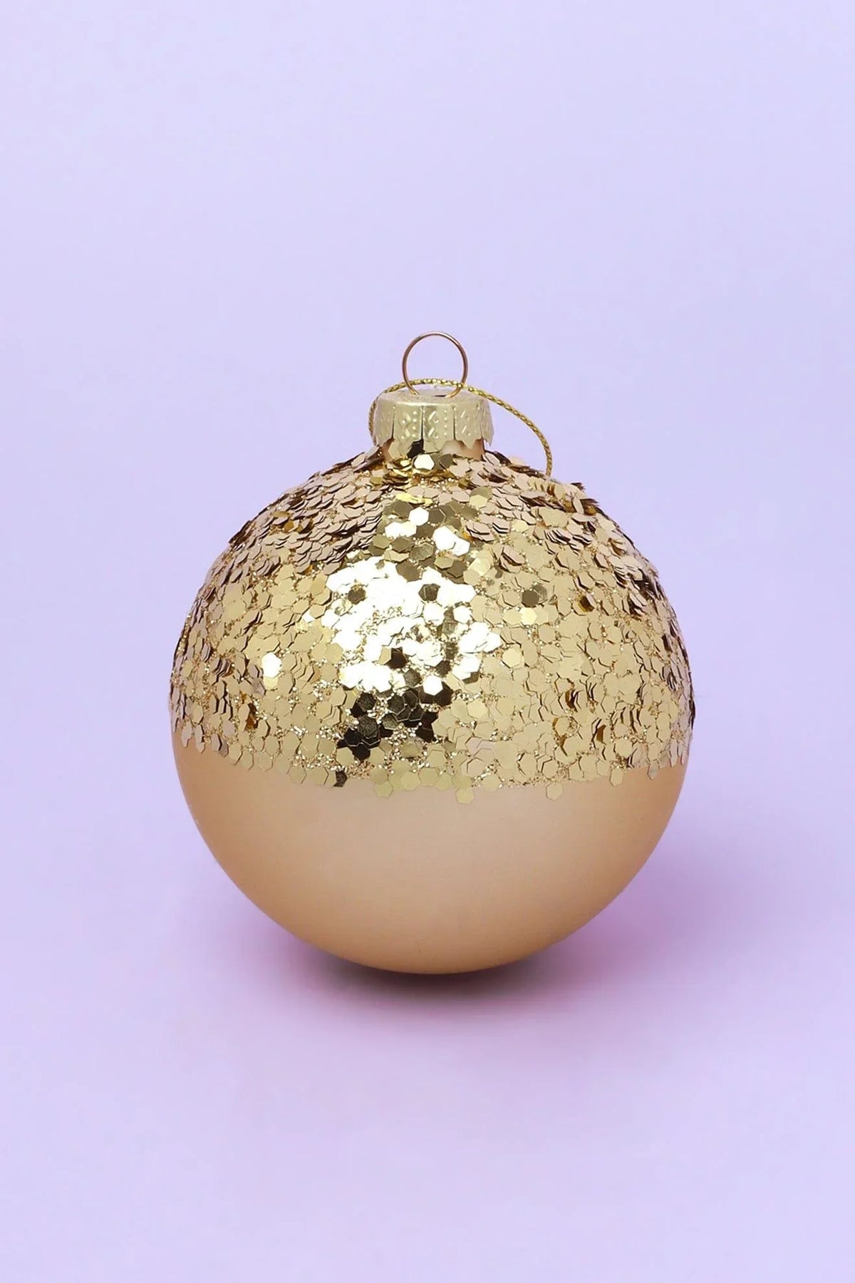 Hand-painted sequin and crackle gold Christmas baubles close-up — G Decor
