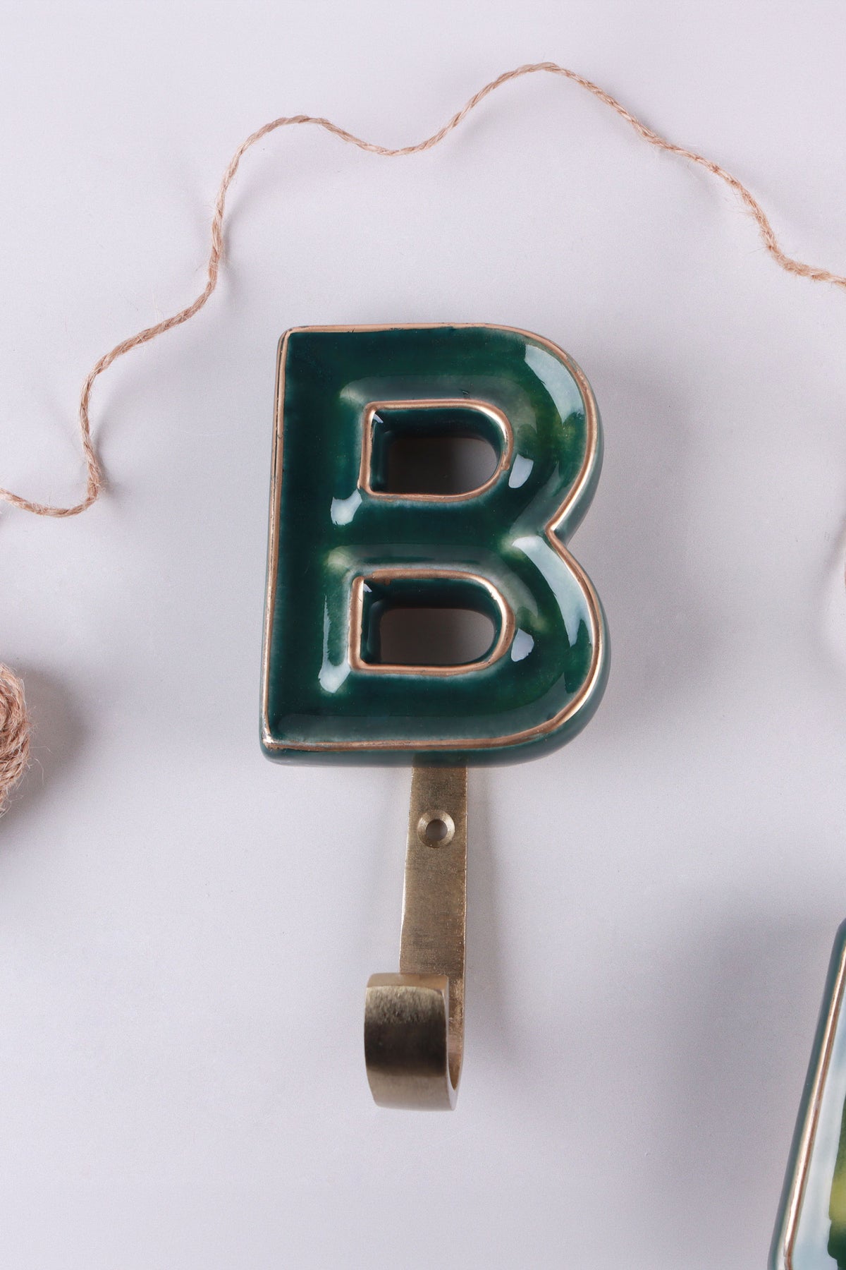 Green ceramic letter hook B with a gold rim