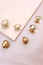 Oval cabinet knob on rose in polished, aged and satin brass, fourth view