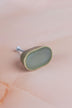 Olive green oval ceramic cabinet knob with a fine crackle glaze, with its fixing bolt