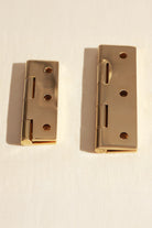 Butt hinge in polished brass, fourth view
