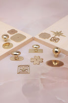 Cabinet knobs and backplates in polished brass, third view