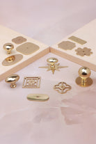 Cabinet knobs and backplates in polished brass