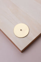 Polished brass round backplate, 45mm across: solid brass with a 4mm centre hole for the knob bolt