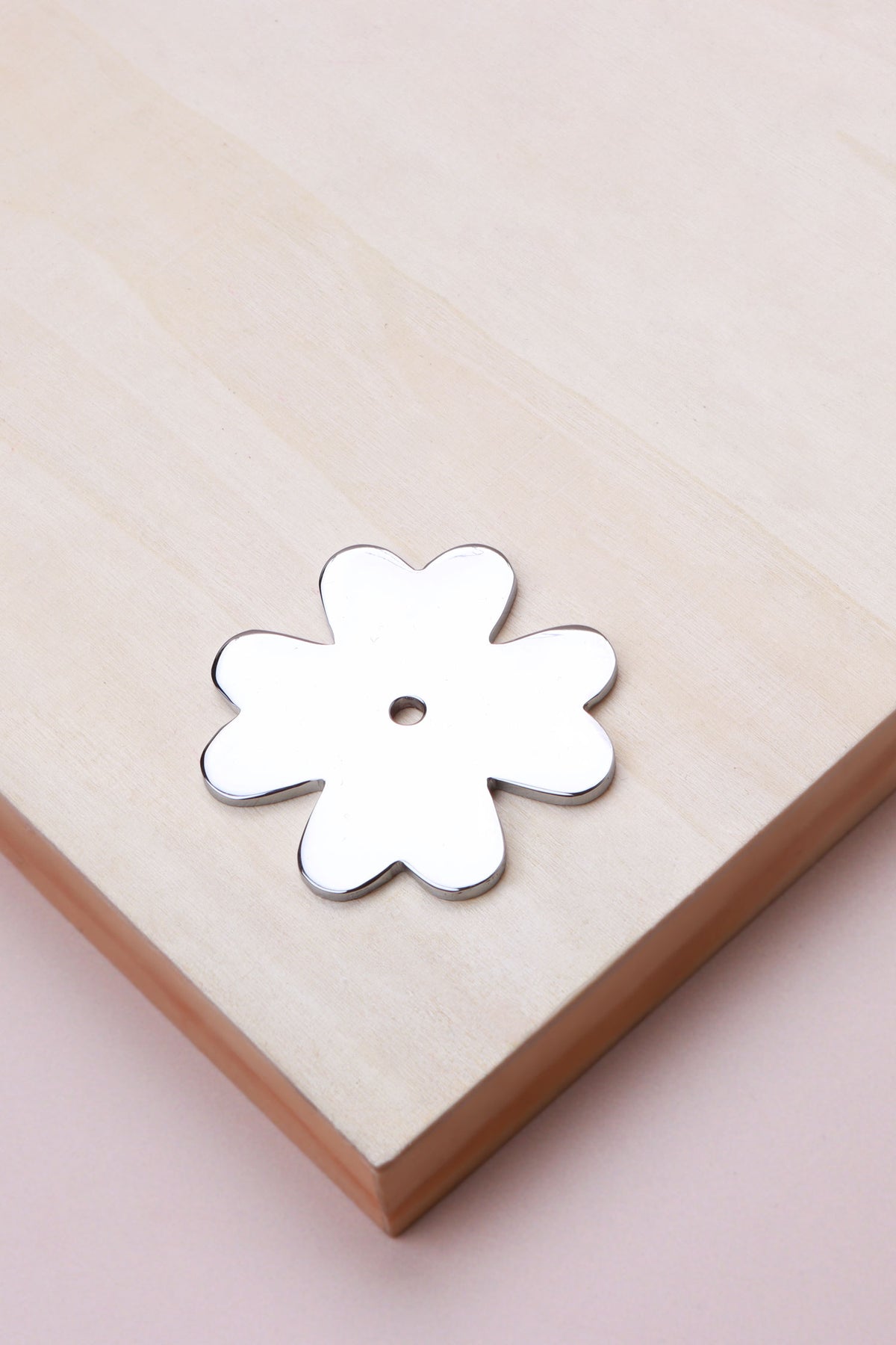 Polished chrome flower backplate, 51 x 51mm: chrome-plated solid brass with a 4mm centre hole for the knob bolt