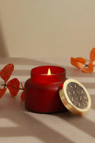 Rasa Ember Sandalwood Scented Candle in Frosted Red Glass — close-up view, G Decor