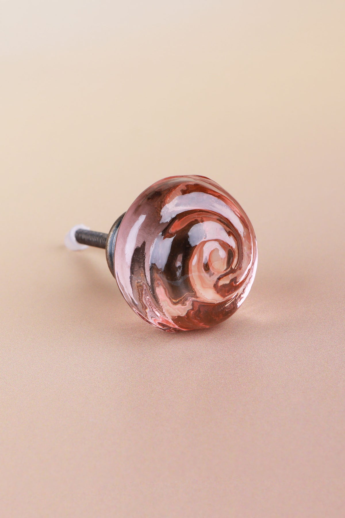 Blush Pink small rose glass cabinet knob, a soft rose tint, with a swirl curling into the centre, on an antique brass finish base