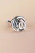 Clear small rose glass cabinet knob, a swirl of glass curling into the centre, on an antique brass finish base