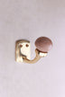 Rosy brown ceramic ball hook: a dusky rose-brown ceramic ball on a curved brass-finish hook with a small back plate and two screws