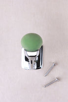 Sage green ceramic ball hook on a chrome finish hook and back plate, with its two chrome finish screws