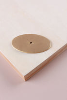 Satin brass oval backplate, 69 x 40mm: solid brass with a 4mm centre hole for the knob bolt