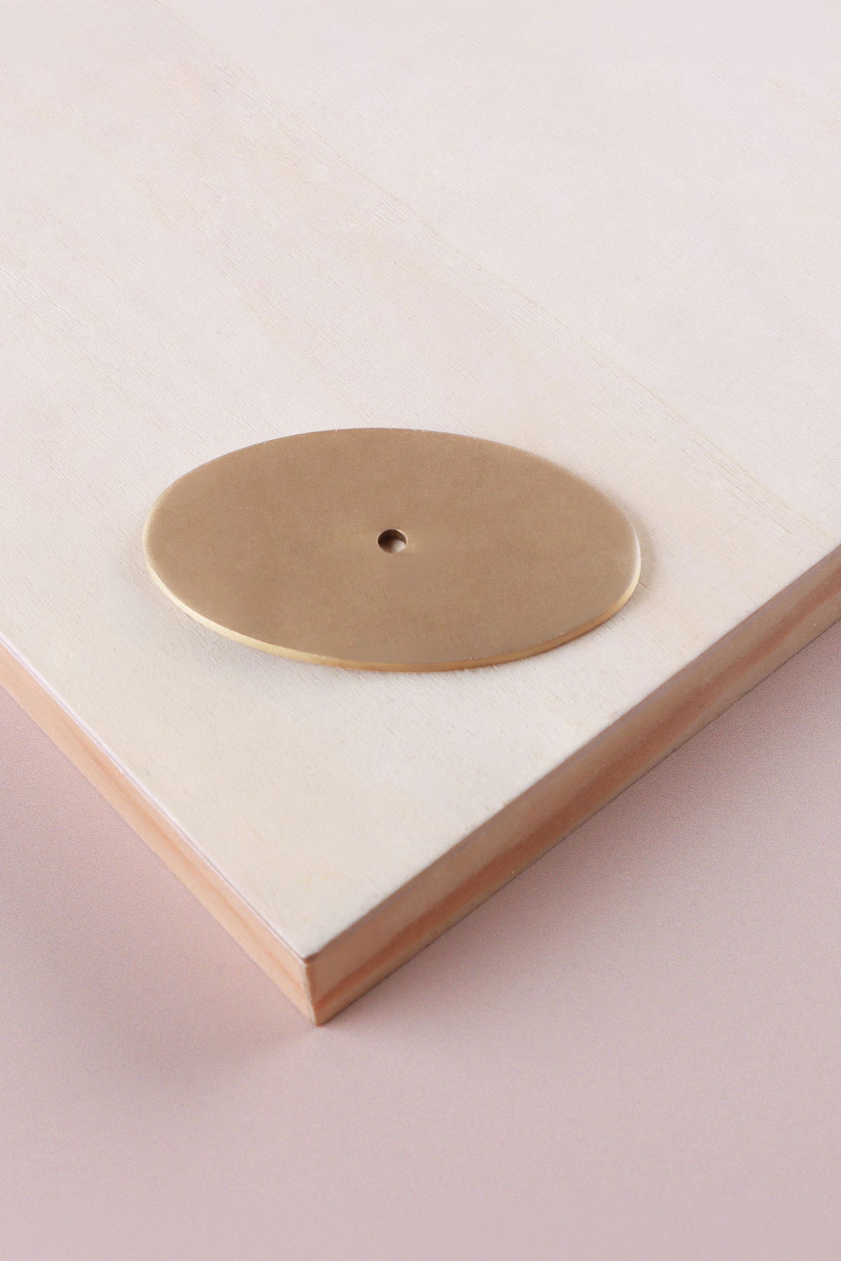 Satin brass oval backplate, 69 x 40mm: solid brass with a 4mm centre hole for the knob bolt