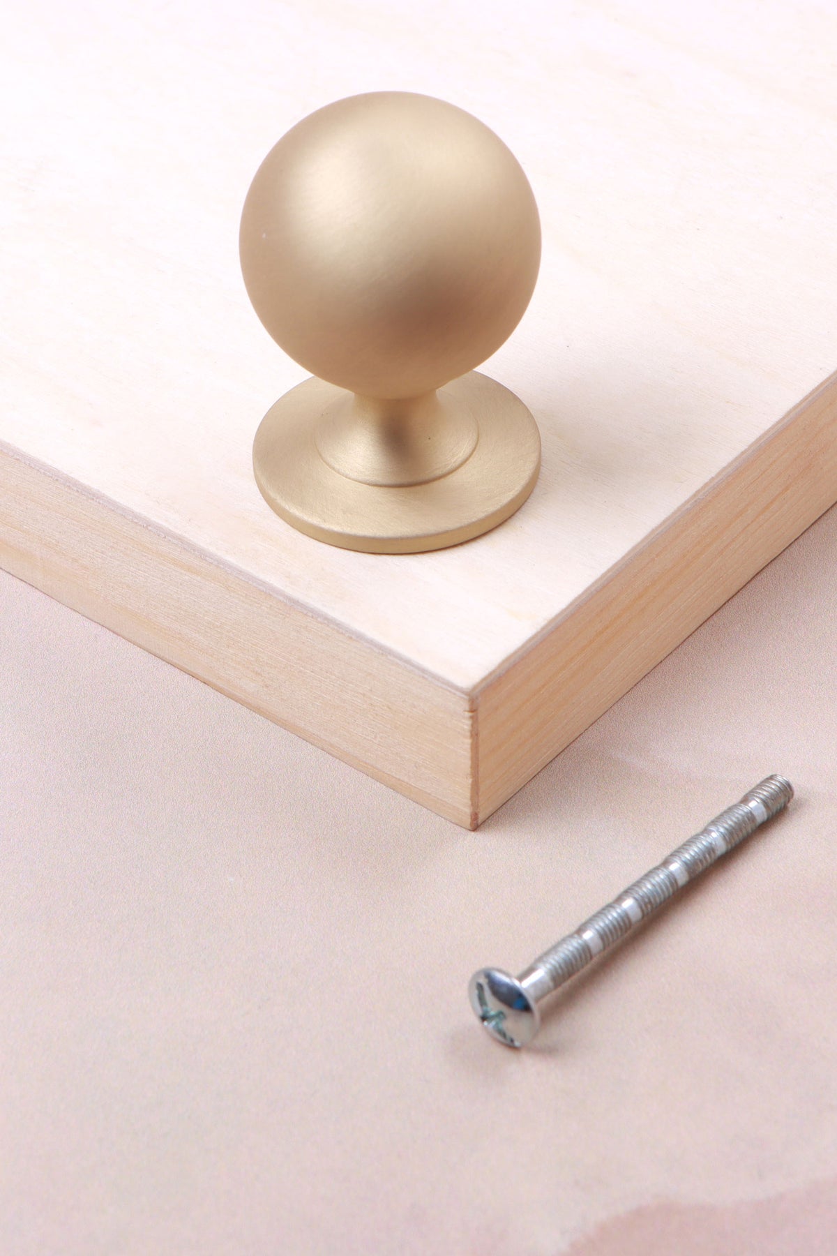 Round cabinet knob in satin brass