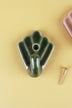 Olive green scallop shell ceramic wall hook, the glaze darker in the grooves, with its brass screw