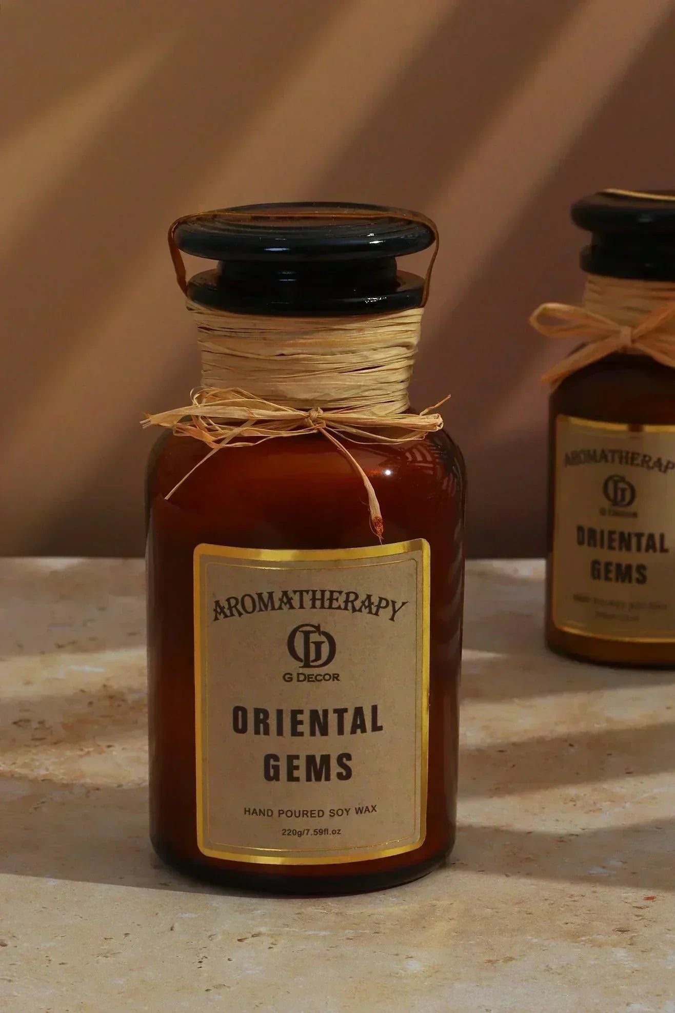 Oriental Gems Elixir Soy Wax Scented Candle in Amber Apothecary Jar — close-up view, G Decor