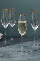 Set of 4 Aurora Clear Ribbed Textured Gold Rim Champagne Flutes - G Decor