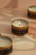 Tranquessence Scented Tin Candle in Black and Gold — close-up view, G Decor