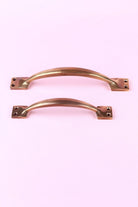 Oxford Solid Aged Brass Door Handle, Curved Pull — close-up view, G Decor