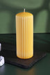 Velluto Sculpted Daffodil Yellow Ribbed Pillar Candle in a Velvet Matte Finish