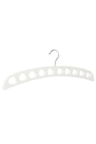 White wooden scarf hanger with a row of round holes and a metal hook