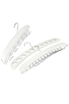 Set of three white wooden accessory hangers: a belt hanger, a scarf hanger with round holes and a tie hanger