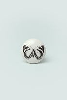 Butterfly Stamp Porcelain Cabinet Knob — close-up view, G Decor