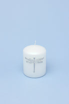 Dragonfly Queen White Pillar Candle with Silver Emblem — close-up view, G Decor