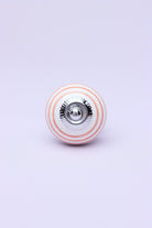 Striped Hand-Painted Ceramic Cabinet Knob in Pink and Yellow — close-up view, G Decor