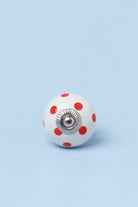 Polka Dot Ceramic Cabinet Knob in Orange and Red — close-up view, G Decor