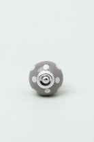 Polka Dot Ceramic Cabinet Knob in Mint and Dark Grey — close-up view, G Decor