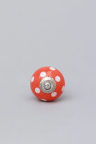 Polka Dot Ceramic Cabinet Knob in Red Light Green and Orange — close-up view, G Decor