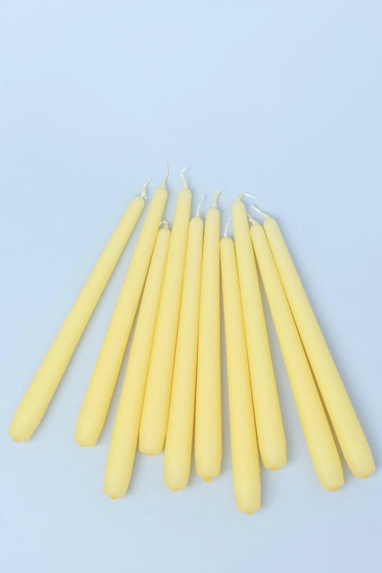 Pastelaria Sand Yellow Tall Pastel Taper Candles — close-up view, G Decor