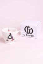 Blossom monogram ceramic mug close-up showing floral alphabet detail — G Decor