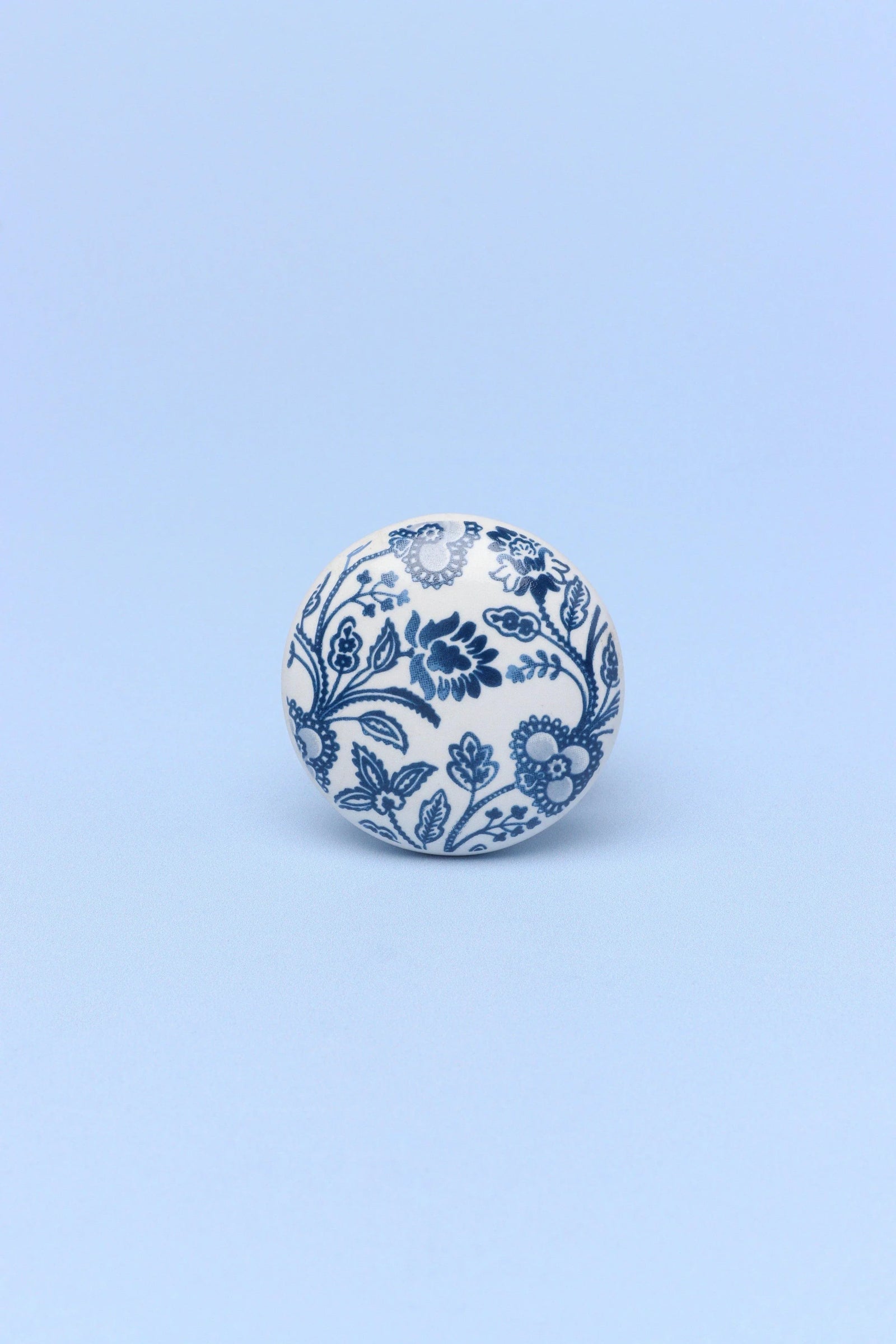 Royal blue ceramic cabinet knob close-up showing hand-painted detail — G Decor