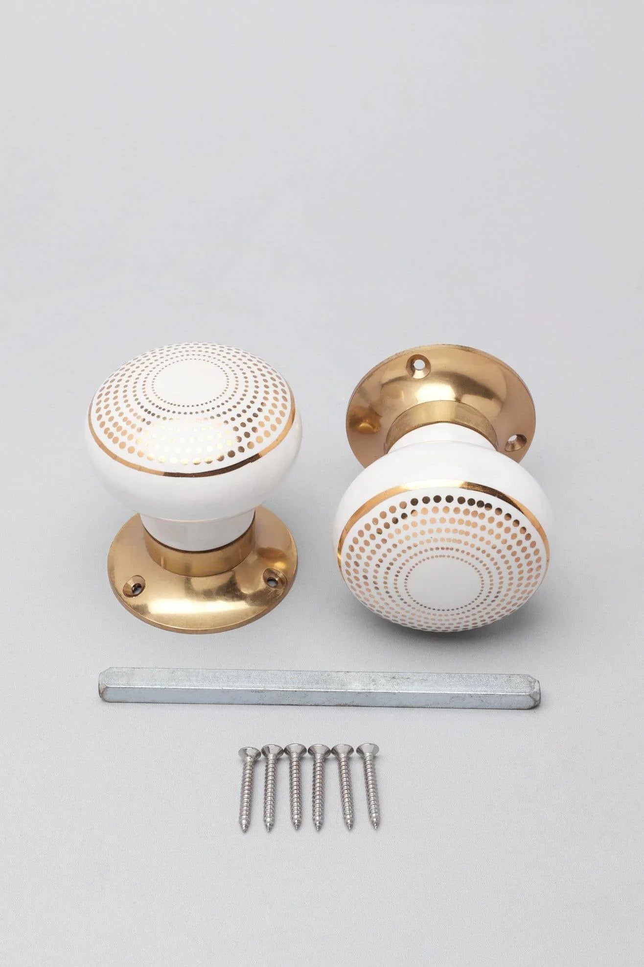 Royal Gold III Dotted Circle Ceramic Mortice Door Knobs with Brass Base — close-up view, G Decor