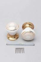 Royal Gold III Dotted Circle Ceramic Mortice Door Knobs with Brass Base — close-up view, G Decor