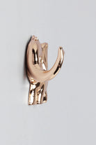 Pair of Elephant Gold Sculpted Wall Hooks — close-up view, G Decor